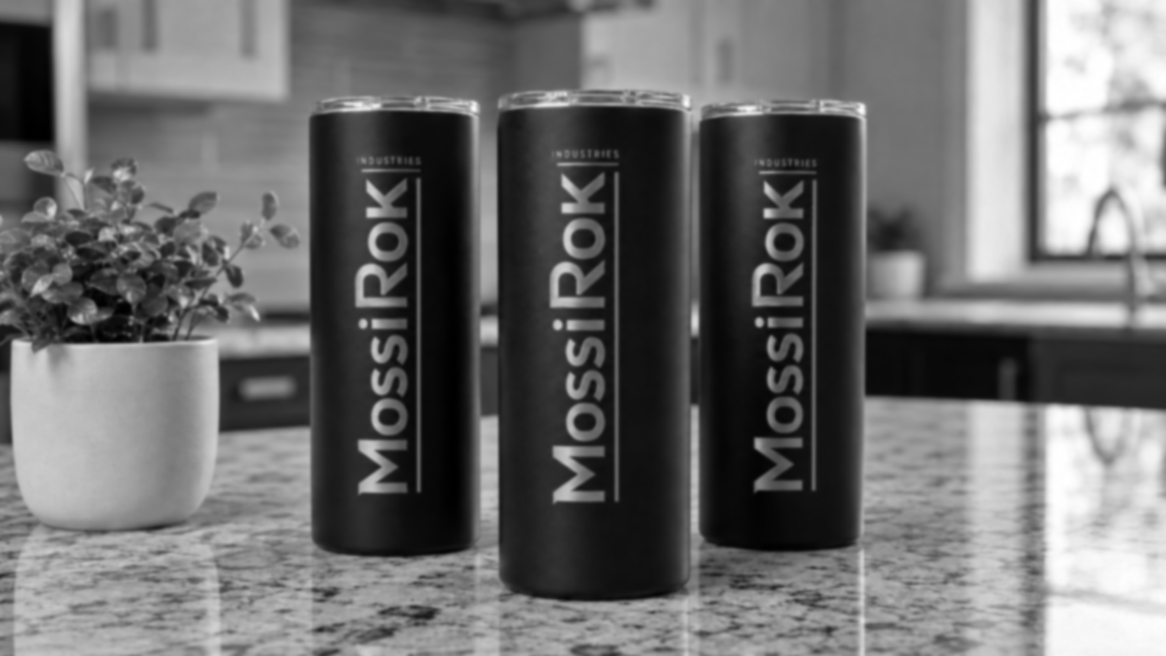 Premium custom tumblers arranged in a modern workshop